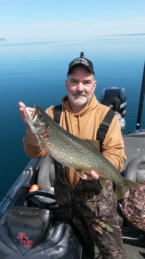 Dan from Jack's Sport Shop with a laker from Torch Lake